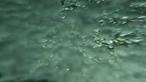 Air bubbles in strong mountain river. Stock Footage 211440506