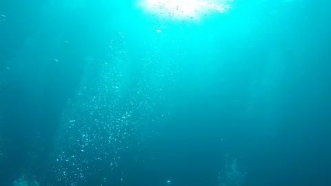 Air bubbles underwater Stock Footage 125928724
