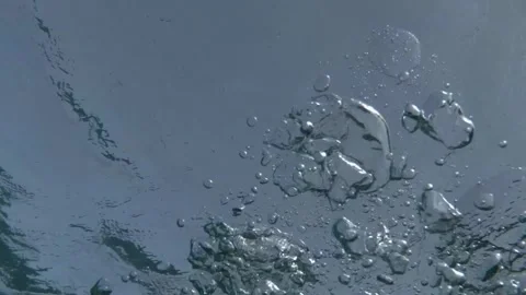 Air bubbles underwater multiplying and spreading while rising to the surface of Stock Footage 294129988