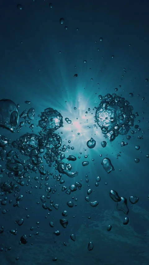 Air bubbles underwater rise to the surface against the backdrop of the sun's ray Stock-Footage 283560401