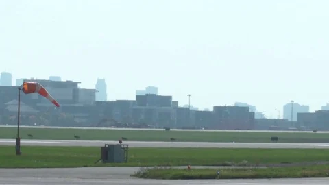 Air Canada CRJ Landing Reverse view with a Windsock Stock Footage 76233499