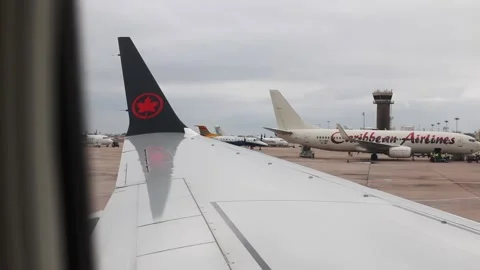 Air Canada Maple Leaf Logo on Wing, Barbados, View from Plane Cabin Stock Footage 155664842