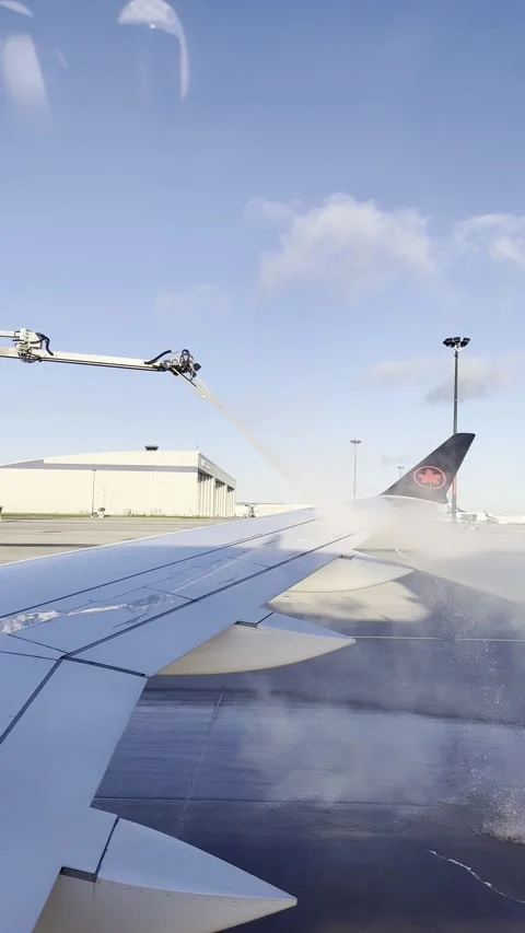 Air Canada wing getting de-iced Stock Footage 165715164