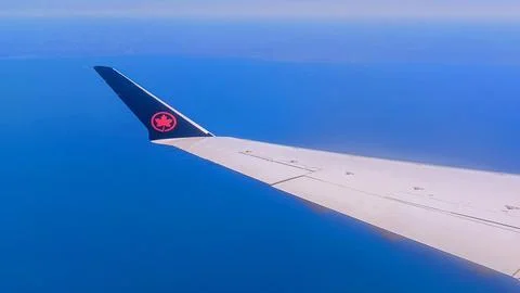 Air Canada Wing Over Clouds Stock Photos