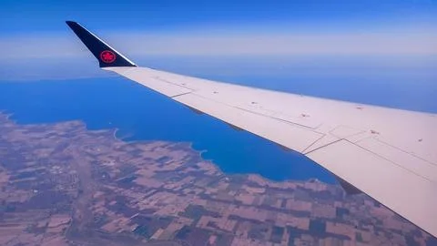 Air Canada Wing Over Clouds Stock Photos