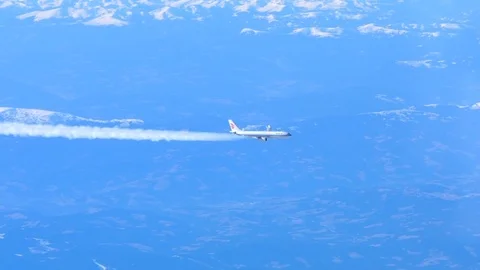 Air China airliner producing contrails, cruising at high altitude Stock Footage