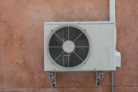 Air compressor on the brick wall Foto stock