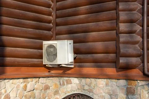 Air compressor, external split wall type of outdoor home air conditioner unit Stock Photos