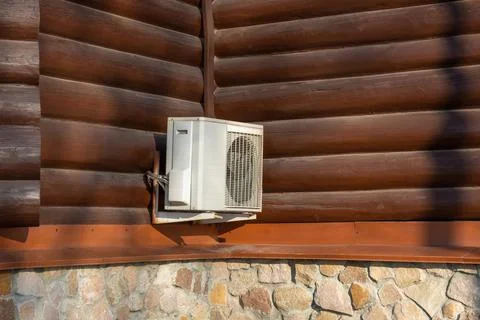 Air compressor, external split wall type of outdoor home air conditioner unit Stock Photos