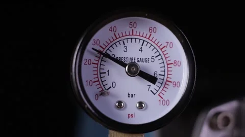 Air compressor manometer close-up slowly increasing the pressure measurement Stock Footage 131189577