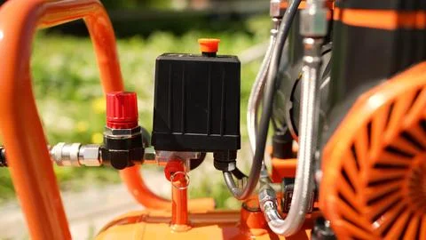 Air compressor system featuring pressure switch and regulator Stock Photos