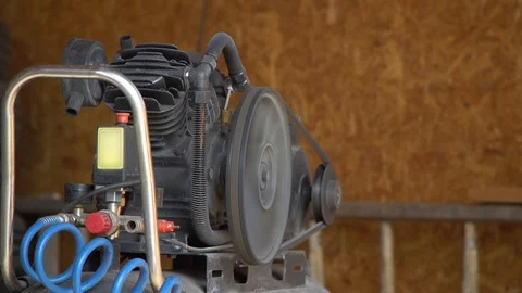 The air compressor works. The compressor injects air into the tank Stock Footage 126749232