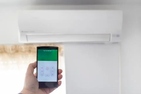 Air condition control through smartphone app Stock Photos