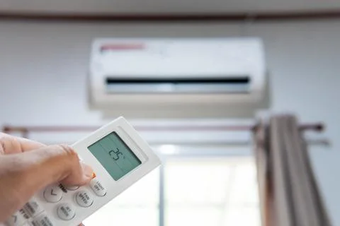 Air condition control by using remote control Stock Photos