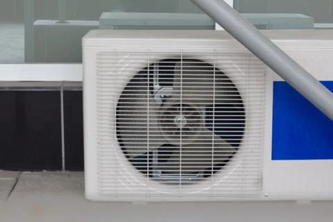 Air conditioner compressor installed in old building. Photos