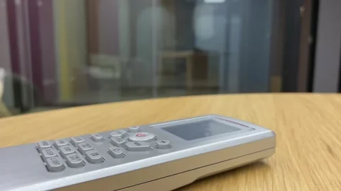 Air conditioner controller on wooden table desk close up view indoor. Stock Footage 251283336