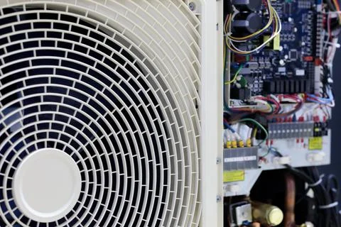 Air conditioner with open electronics control unit Stock Photos