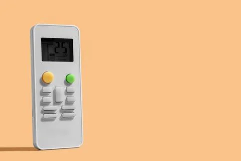 Air conditioner remote control on beige background, closeup Stock Photos