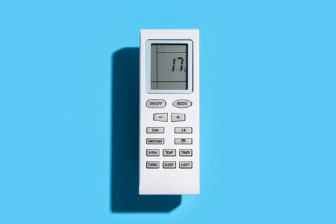 Air conditioner remote control on blue background Stock Photos