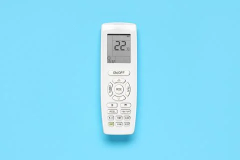 Air conditioner remote control on blue background Stock Photos