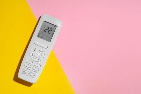 Air conditioner remote control on color background Stock Photos
