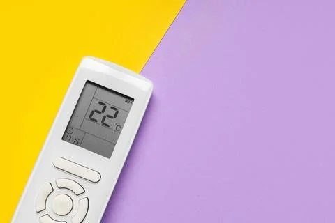 Air conditioner remote control on color background Stock Photos