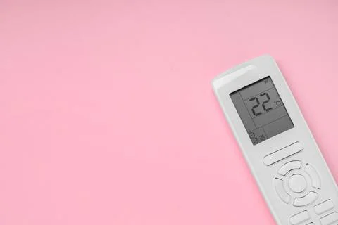 Air conditioner remote control on pink background Stock Photos