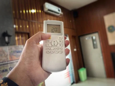 Air conditioner remote control set to 20°C Stock Photos