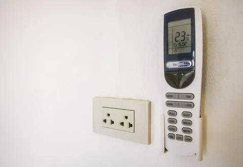 Air Conditioner Remote Control In Wall Holder Ready For Use Thai Hotel Thai.. Stock-Fotos
