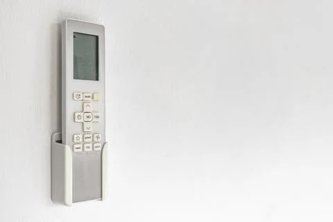 Air Conditioner Remote Control In Wall Holder Ready For Use Thai Hotel Thai.. Stock-Fotos