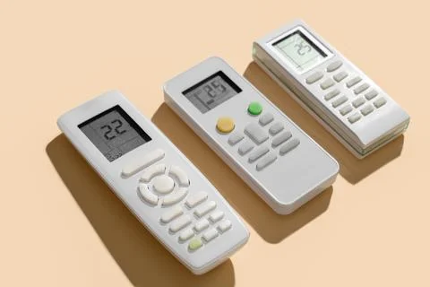 Air conditioner remote controls on beige background, closeup Stock Photos