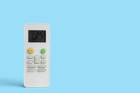 Air conditioner remote controls on blue background, closeup Stock Photos