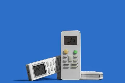 Air conditioner remote controls on blue background, closeup Stock Photos