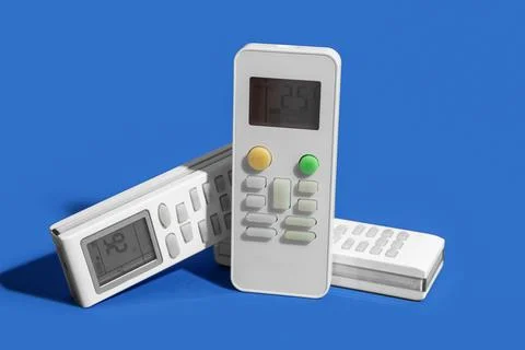 Air conditioner remote controls on blue background, closeup Stock Photos