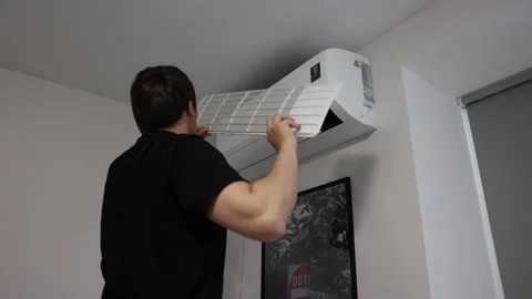 Air Conditioner Service Taking Filter Off. AC Cleaning Service Maintenance Stock Footage 202082050