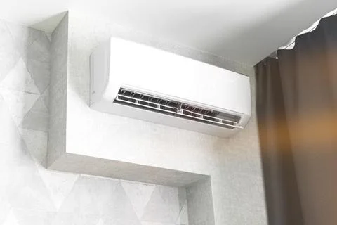 Air conditioner system on white wall living room interior, modern design conc Stock Photos