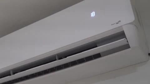 Air conditioner turning on and cooling room Stock Footage 320968085