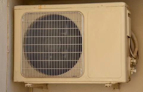 Air conditioner unit compressor outside a home. Condenser Fan for support res Stock Photos