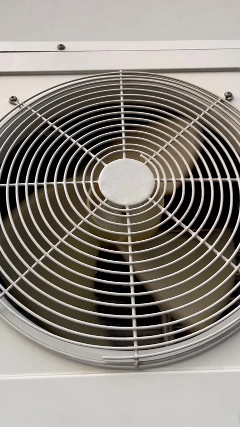 Air Conditioner Unit Fan Blades Spinning Behind Metal Protective Grille Frame Stock Footage 341674399