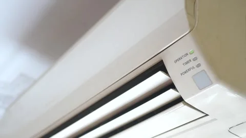Air conditioner unit with operation light glowing and vents moving slowly. 스톡 동영상 332626508