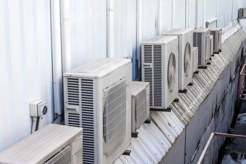 Air conditioners compressor outdoor unit installed many lot row outside the h Stock Photos