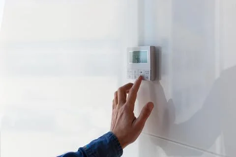 The air conditioning and heating control panel for the apartment and office is Stock Photos