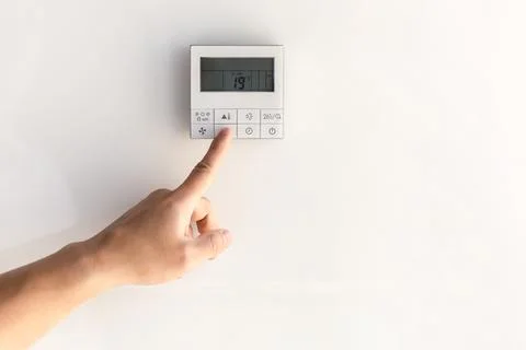 The air conditioning and heating control panel for the apartment and office is Stock Photos