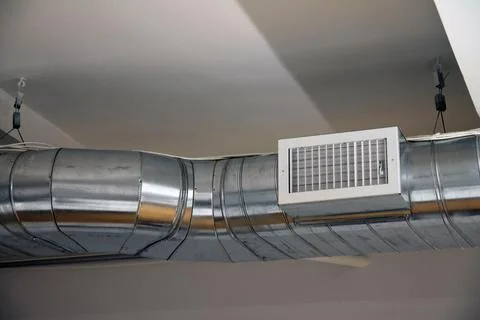 Air conditioning and heating dispatching system on the ceiling of an industri Stock Photos