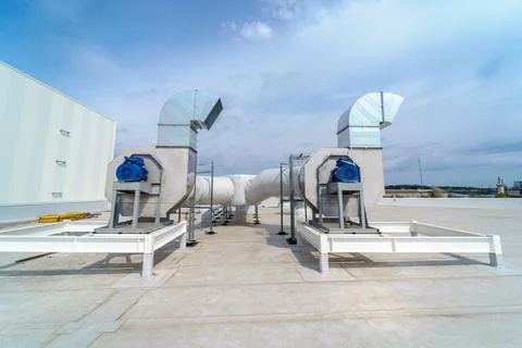 The air conditioning and ventilation system of industrial building on the roof Stock Photos