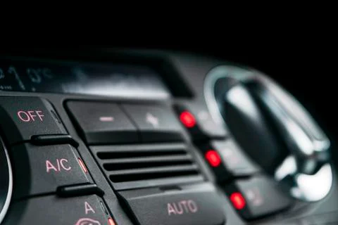 Air conditioning button inside a car. Climate control AC unit in the new car. Photos