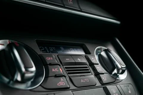 Air conditioning button inside a car. Climate control AC unit in the new car. Photos