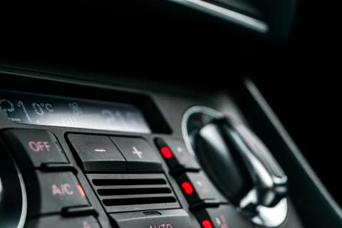 Air conditioning button inside a car. Climate control AC unit in the new car. Stock Photos