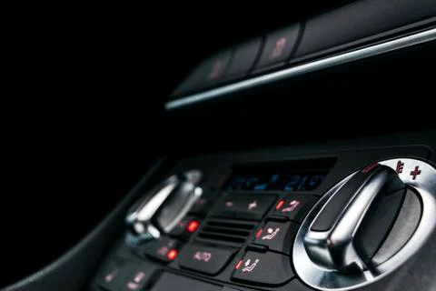 Air conditioning button inside a car. Climate control AC unit in the new car. Photos
