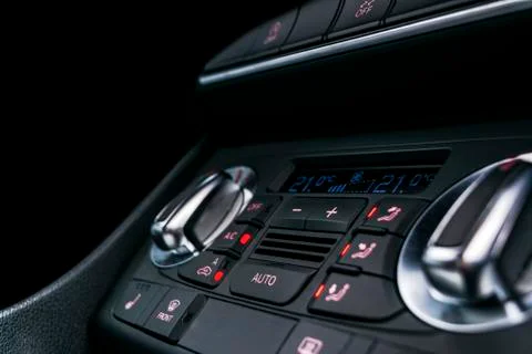 Air conditioning button inside a car. Climate control AC unit in the new car. Photos